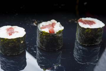 Sushi set isolated on black background