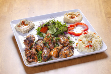 traditional arabian food dish with spicy chicken wings