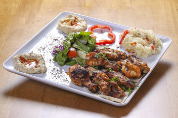 traditional arabian food dish with spicy chicken wings