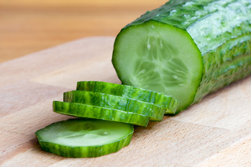A slices of cucumber on the cutting board