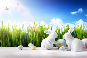 art Little Easter bunny and Easter eggs on green grass