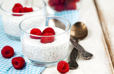Yogurt with chia seeds and fresh raspberries for healthy breakfa