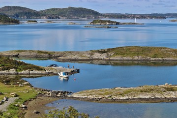 On the road in Norway, from Bergen to Stavanger: A coastal landscape with many small islands, reefs...