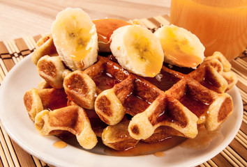Home made heart shaped waffles served in a traditional cast iron waffle pan.