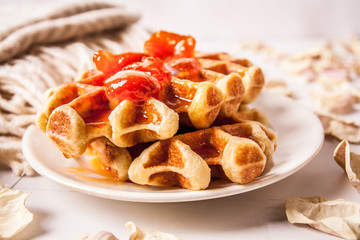 Home made heart shaped waffles served in a traditional cast iron waffle pan.