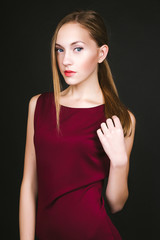 Studio photo of young  woman on black background