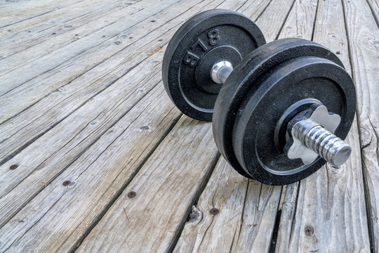 cast iron dumbbell on deck