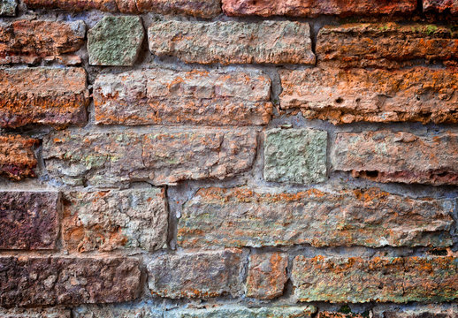 Old brick wall. Apply color and lighting effects. Colorful picture. Deep, rich,  bright colors.  Vignetting. Art reception.