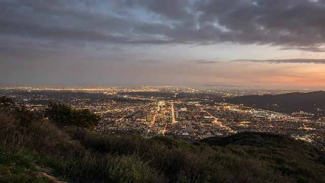 Glendale and downtown Los Angeles dusk to night mountaintop time lapse view.