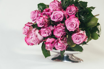 Bouquet of pink roses on white background