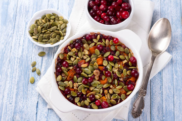 Millet pumpkin gratin with cranberries, walnuts and pumpkin seeds