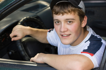Young man in the cabin while driving