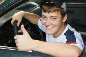Young man in the cabin while driving