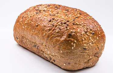 baked bread with seeds on white background