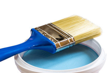 Brush and blue paint jar with
