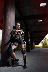 Naklejka premium sexy military armed girl with the weapon
