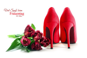 Frauen tag, Ladies red high heel shoes and tulips isolated on white, german