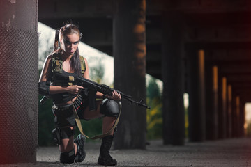 Fototapeta na wymiar sexy military armed girl with the weapon, sniper