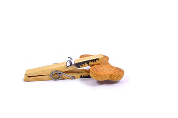 Dog made with a clothes pin with a bone in its mouth