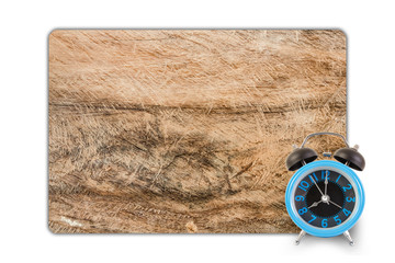 Alarm clock on wood texture background.