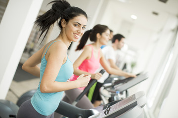 Fototapeta premium Young people training in the gym