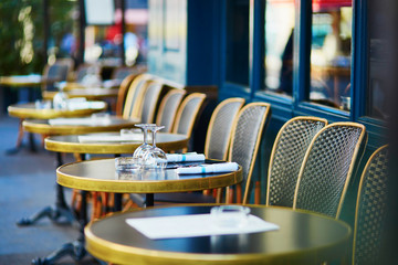Glasses on a table of cozy Parisian outdoor cafe