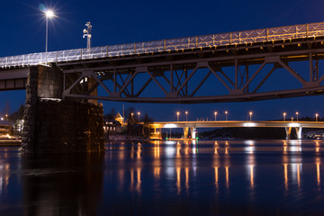 Fototapeta na wymiar Bridges over a nightly stream