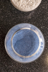 Composite materials. Marble aggregate. Focus in the center of the container with a marble crumb