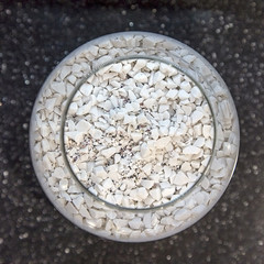 Composite materials. Marble aggregate. Focus in the center of the container with a marble crumb