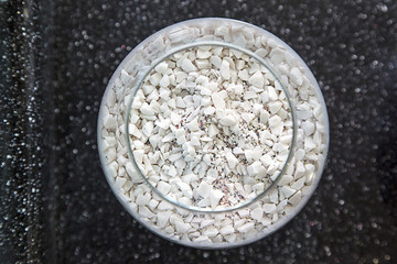 Composite materials. Marble aggregate. Focus in the center of the container with a marble crumb