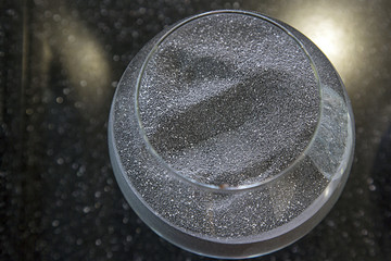 Composite materials. Marble aggregate. Focus in the center of the container with a marble crumb