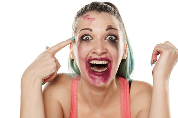 crazy and smiling young woman with smeared makeup - obrazy, fototapety, plakaty