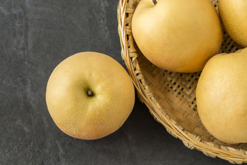 Asian Pears with a bamboo tray on the slate background
