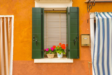 Beautiful window decorated with flowers in italy