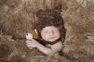 sleeping baby and teddy