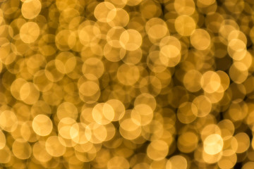 Abstract light celebration blur background, golden lights.