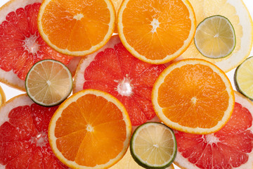 background of colorful slices of tropical fruits