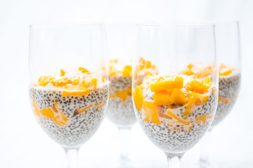 chia and mango pudding on a white background 