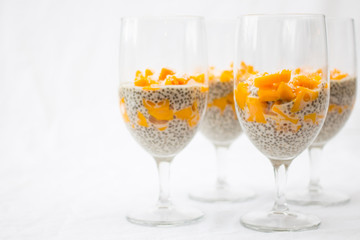 chia and mango pudding on a white background 
