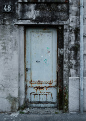 a door closed, view of a closed  rusty door
