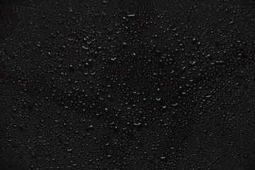 Fototapeta na wymiar water drops on black