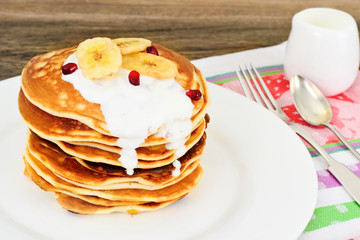 Pancake with Banana, Pomegranate and Sour Cream
