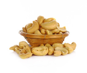 cashew nuts heap in basket on white background