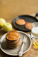 Delicious pancakes close up, with honey