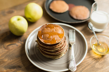 Delicious pancakes close up, with honey