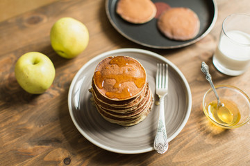 Delicious pancakes close up, with honey, top view