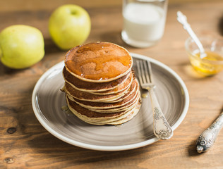 Delicious pancakes close up, with honey