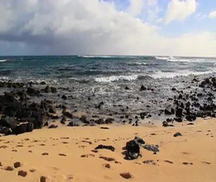 Waves crashing on a Hawaiian island beach. High definition footage.