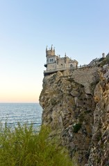 Fototapeta na wymiar Scenic evening view of the well-known castle Swallow's Nest near Yalta. Crimea. Sunset