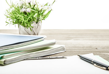Office desk with blank paper.
